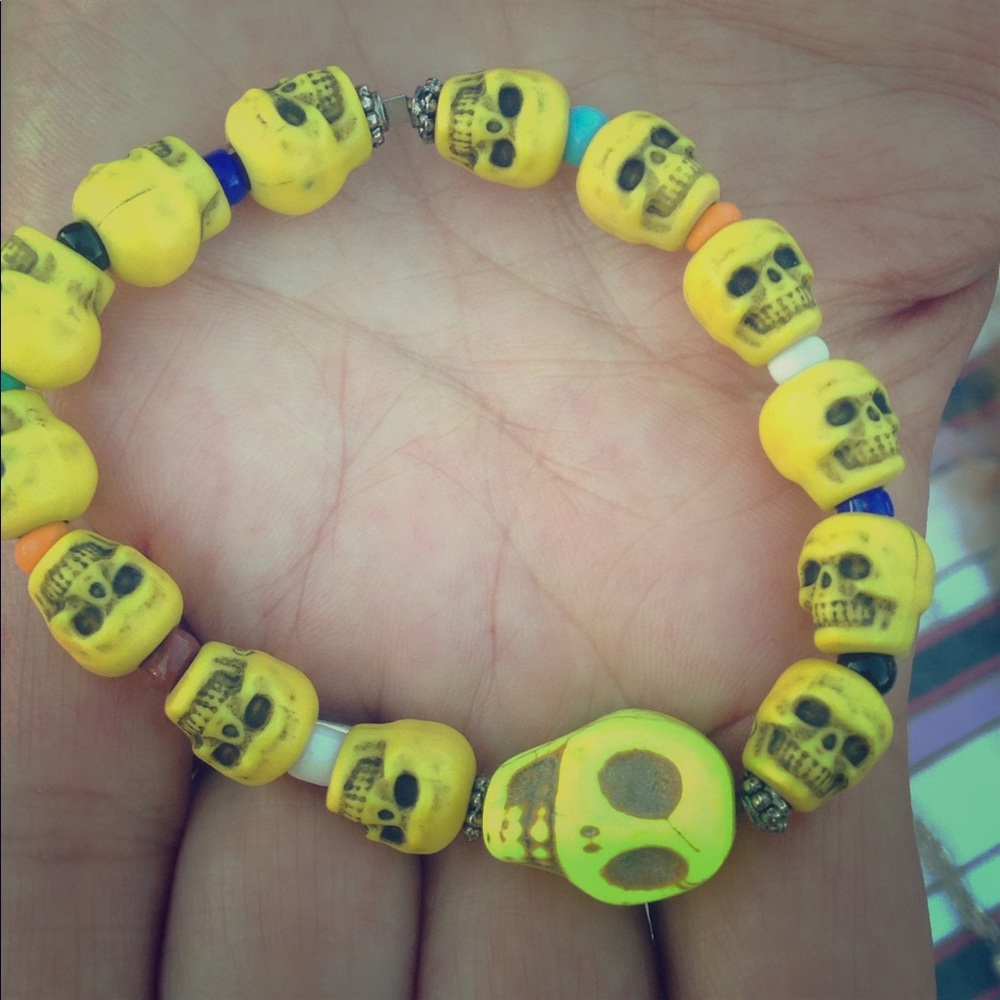 A sugar skull sun braclet